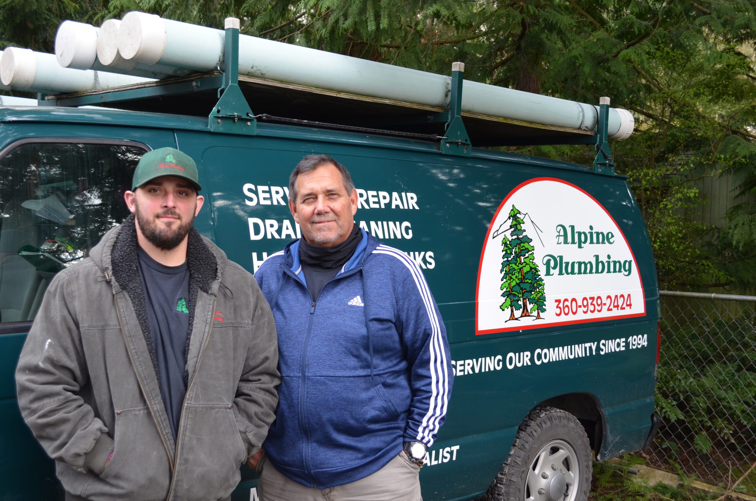 Alpine Plumbing technicians in front of company van, serving Marysville, WA