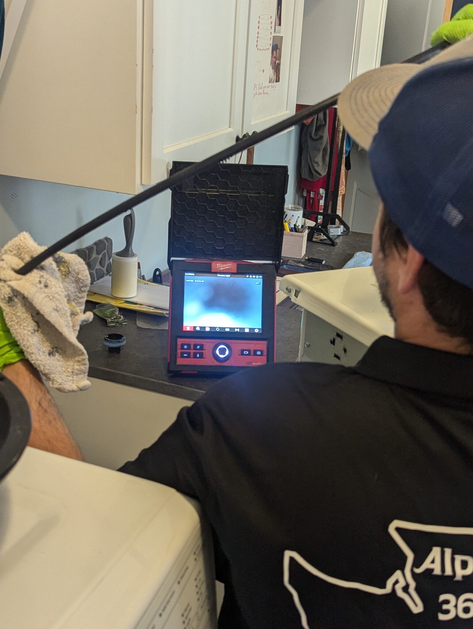Plumber reviewing a drain inspection camera feed during drain cleaning service in Marysville, WA